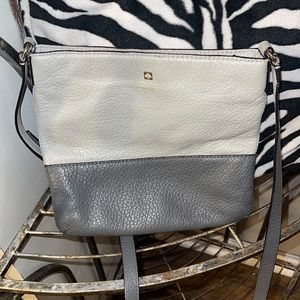 Kate spade pebbled leather grey with pink and white stripe inside great conditio